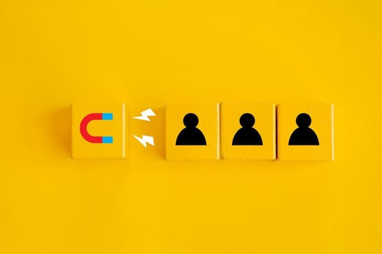 Comparison of traditional vs AI-powered lead generation with a magnet attracting leads.