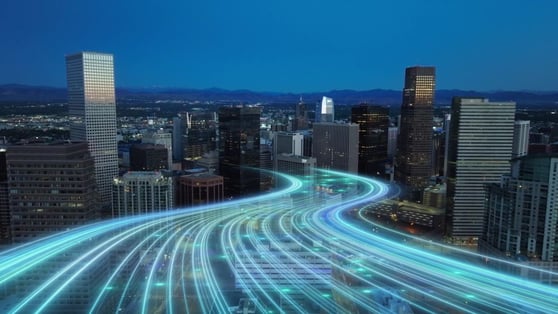 City with skyscrapers and digital animation showing business digitalization.