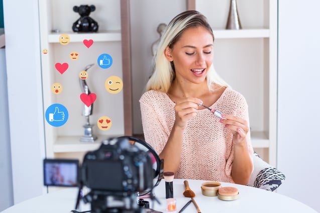 Influencer sharing content as part of digital word of mouth marketing on social media platforms.