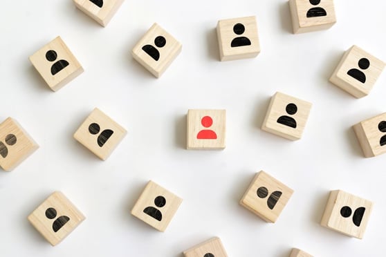 Red person icon stand out from the crowd on white background.