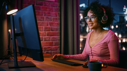 Creative Female Smiling, Checking Social Media, Browsing Videos on Internet. 