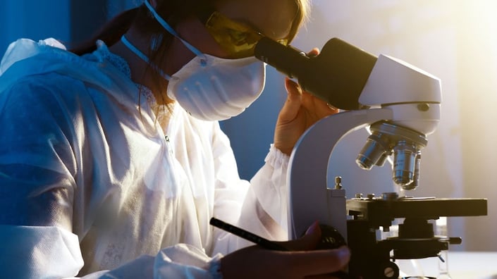 AI in healthcare aiding drug discovery, with a scientist researching new treatments using AI-driven molecular analysis. 